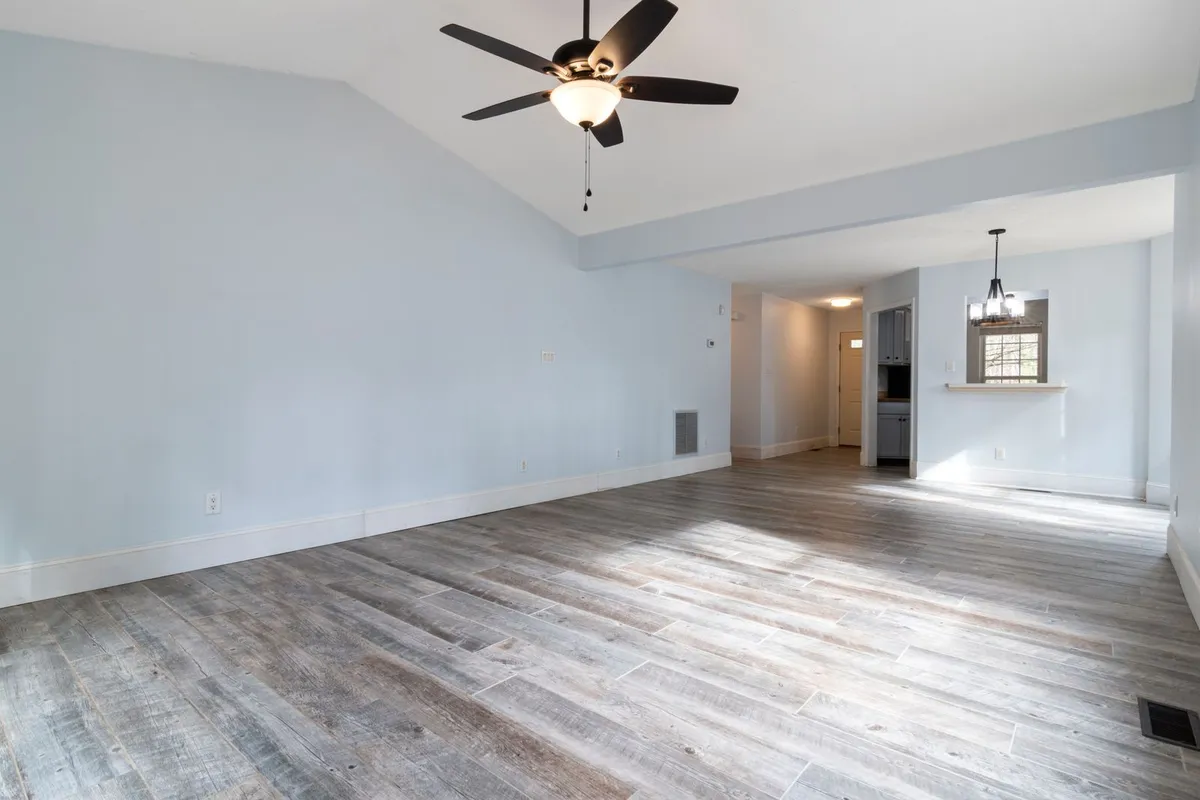 One long, straight run is the cheapest footage there is — few corners, no doorways to cut around, and the caulked top edge is the finish line the painting share of the budget pays for