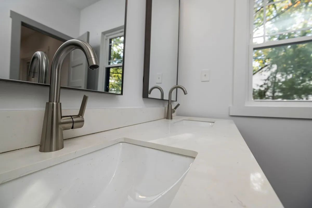 The faucet is a priced line of every replacement — This Old House's itemized standard job carries its faucet at $249, inside a $2,110 total