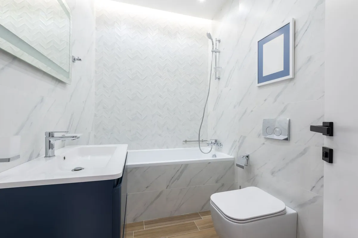 The standard alcove replacement this page prices as typical: new tub in the same footprint, plumbing unmoved, surround renewed with it