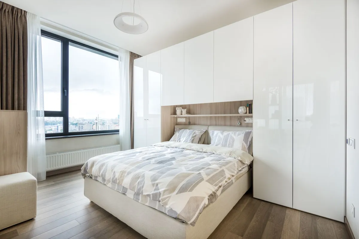 Fitted wardrobes are the alternative to a walk-in where the room cannot spare the floor space — HomeGuide prices a built-in wardrobe at $1,500–$4,500, and premium doors, drawers and lighting are what move a quote toward the top of that band