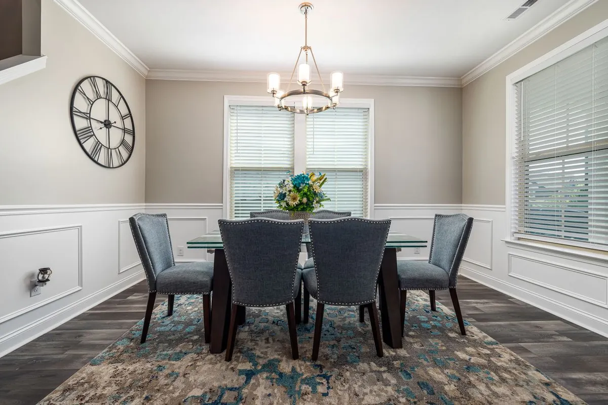 Crown is priced by the linear foot of wall, not by floor area: measure the perimeter, then add about 10% for cutting waste, as HomeGuide advises