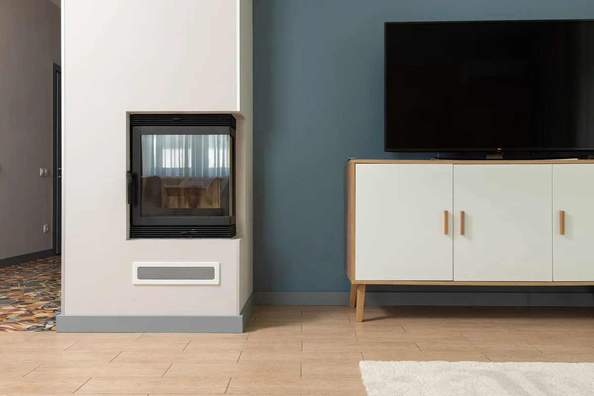 A sealed glass-front insert is the efficient end of the range — inserts reuse the existing chimney and surround, which is why they price below a new build