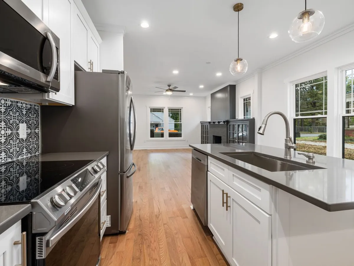 Kitchen island with an undermount sink and a gooseneck faucet