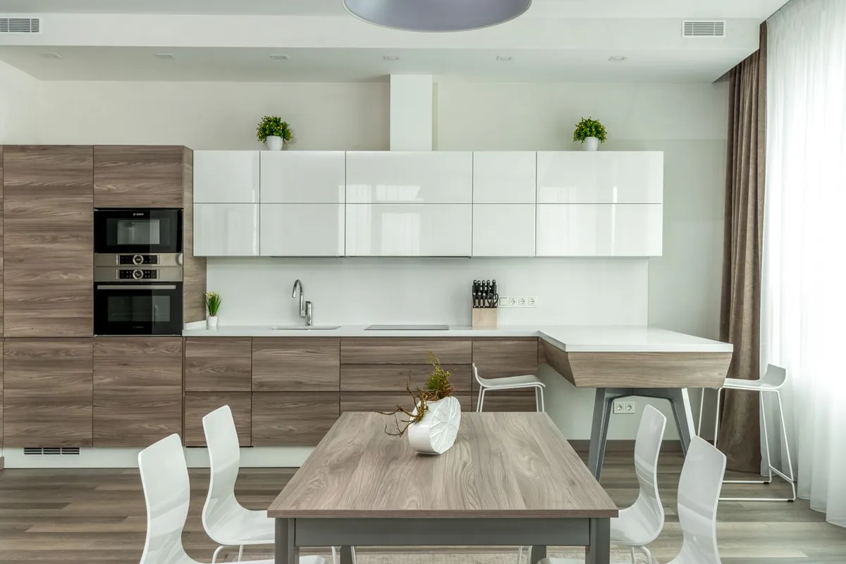 The swap itself is about an hour of labor in Angi at $50–$100 per hour — the drain layout and the dishwasher inlet connection under the sink are what the installer is really checking
