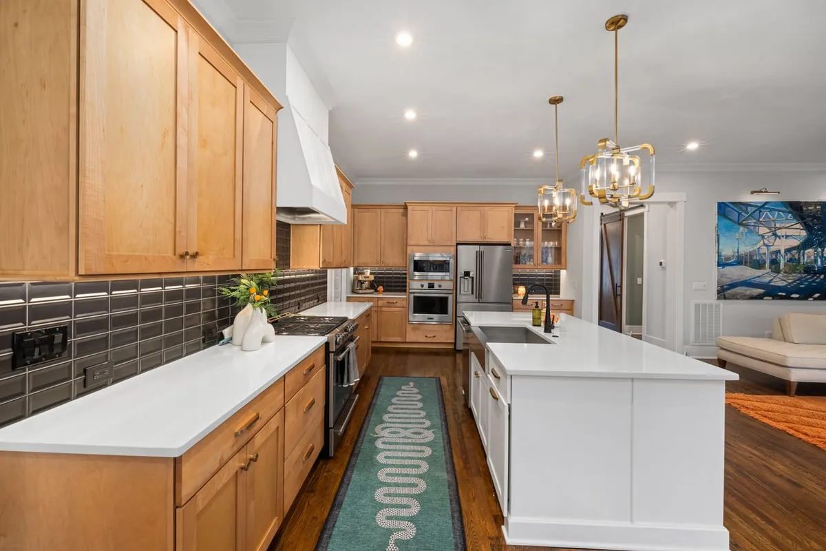 Cabinets are 40–50% of an island bill: HomeGuide prices island cabinets at $500–$1,200 per linear foot, so the cabinet grade matters more than the top you put on it