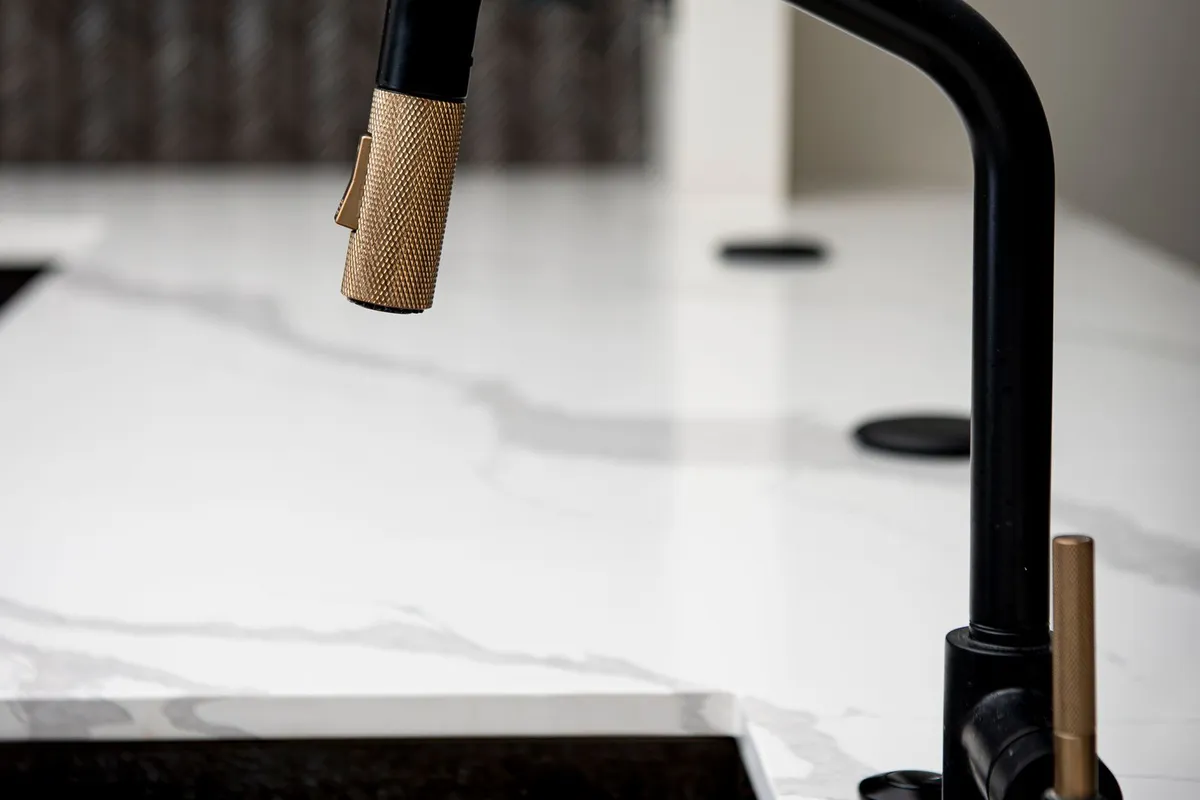 The faucet is a separate line in every guide: Angi prices faucet installation at $90–$600 alongside a sink, and PlumbinGuide puts the faucet itself at $80–$400 plus $100–$250 of labor