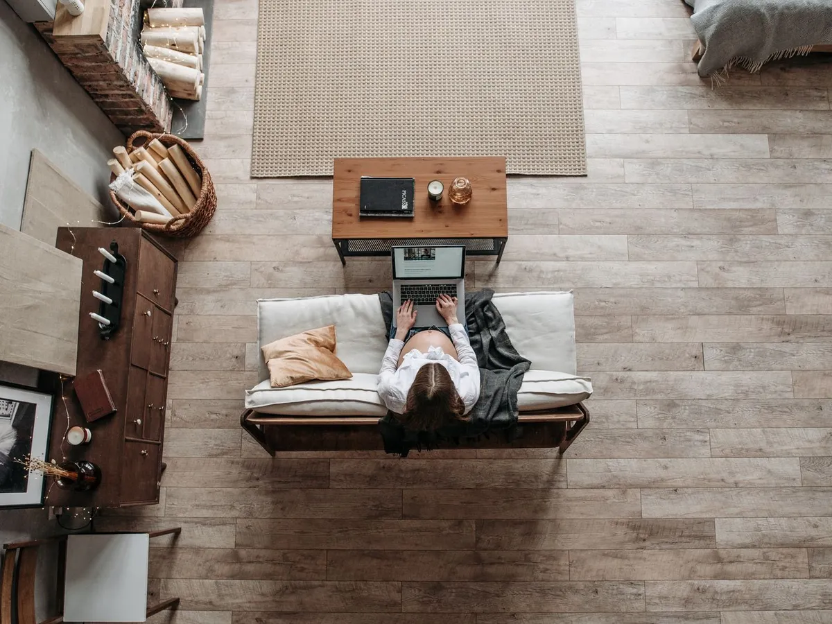 Living room seen from above with a gray-brown wood-look vinyl plank floor