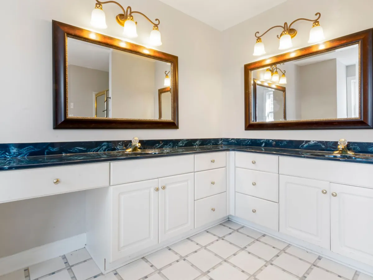Bathroom double vanity topped with deep blue swirled stone counters