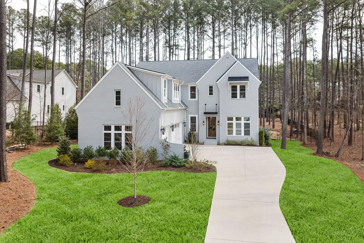 The site decides the excavation line before the pool is chosen: HomeGuide prices excavation at $1,000–$5,000 and tree removal at $150–$2,000, and tight or wooded access is what pushes both