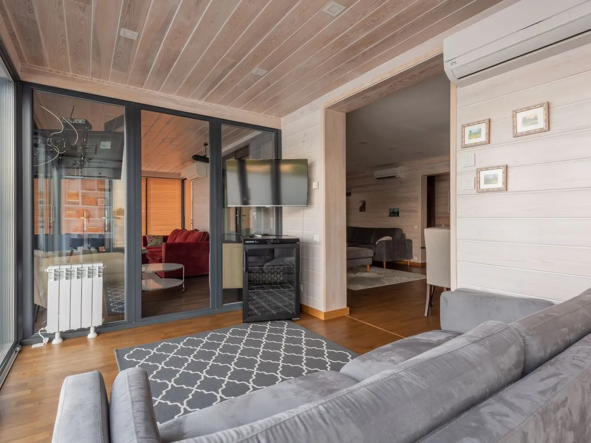 Room with whitewashed horizontal shiplap plank walls and a matching plank ceiling