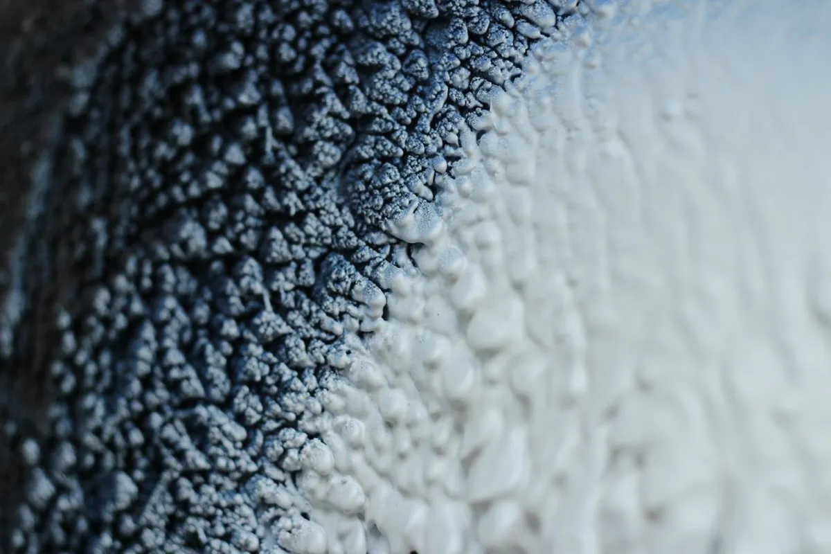 Depth is money at this magnification: foam is priced by the board foot, so every added inch across 1,000 square feet adds 1,000 board feet to the material line