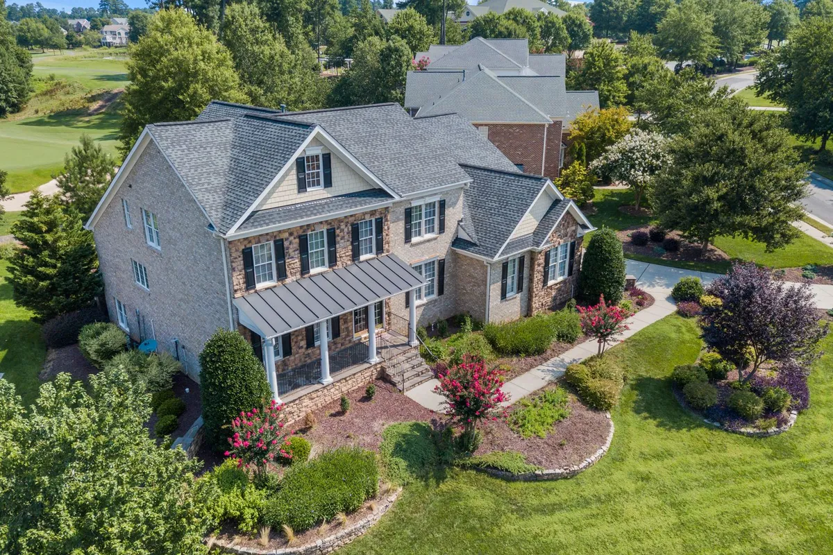 Lawn size sets the zone count from above: HomeGuide prices a 1/4-acre system at $3,000–$10,000 and a 1/2-acre at $5,000–$14,000