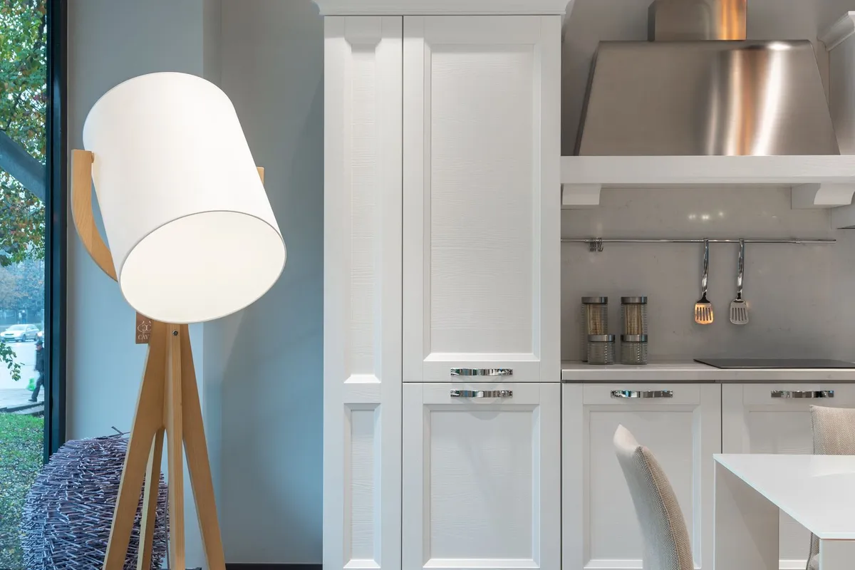 A stainless steel range hood over a light counter in close view — fabrication is 65–80% of a stainless budget, and formed steel work like this hood is what that fabrication line buys.