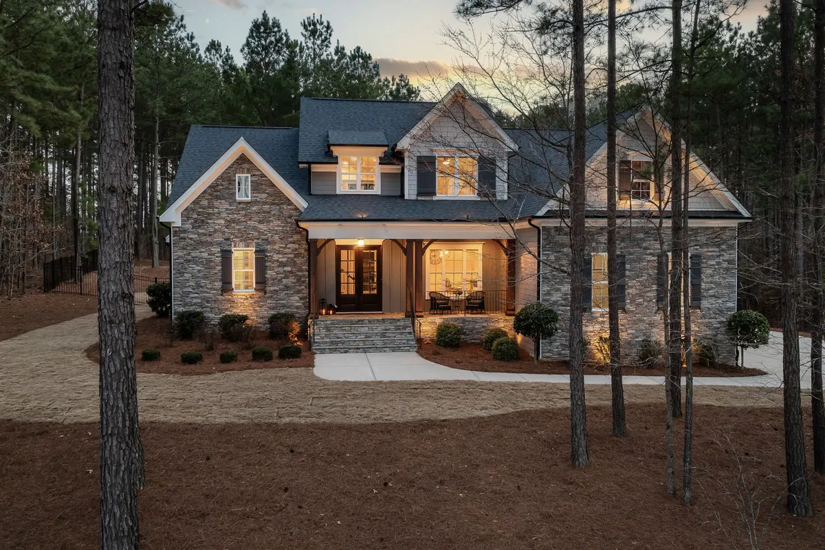 A sound, square frame behind a porch like this is a 2–4 hour installation in HomeGuide; it is the opening that needs reframing — $1,220 on average in HomeAdvisor — that breaks storm door budgets