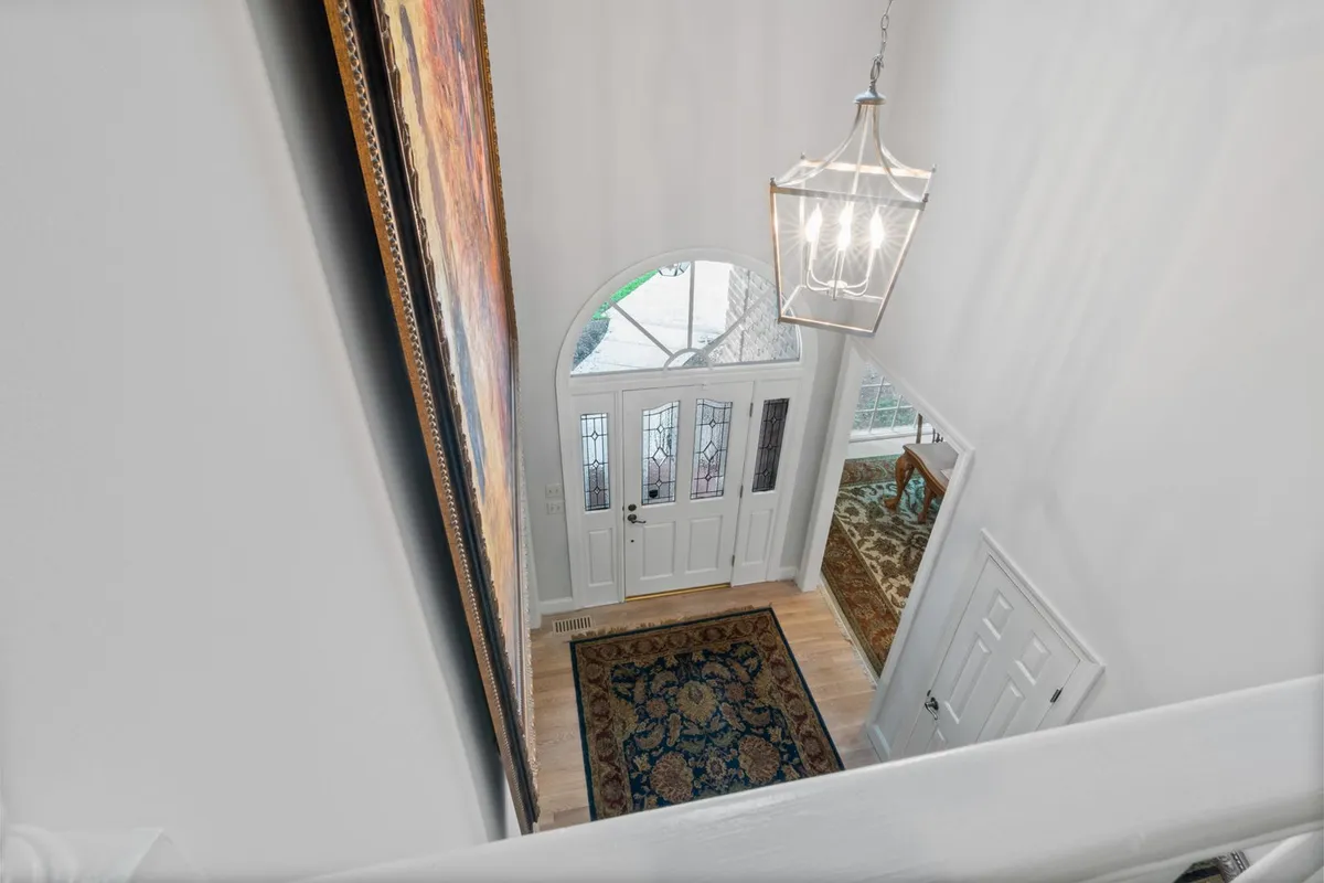 From inside, the storm door's job is the seal around a glazed entry like this one — the glass share of the door is what moves the price, with low-E panes at $25–$50 extra in HomeAdvisor