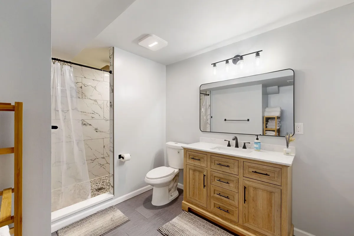 A single prefab unit is the budget end done properly — Angi's vanity range starts at $300 for a small like-for-like swap with the plumbing unmoved