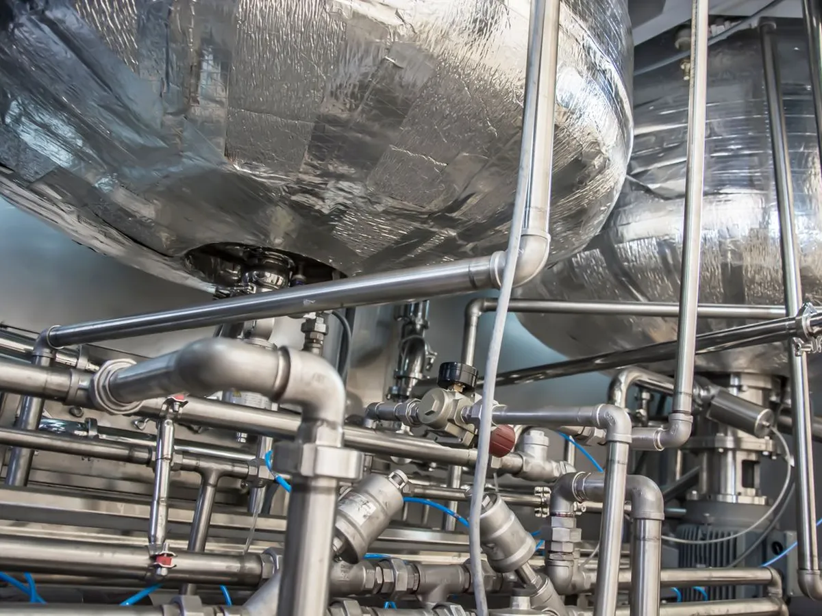 Large insulated treatment tanks with stainless pipework and valves